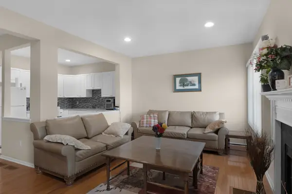 Living room with fireplace and hardwood floors