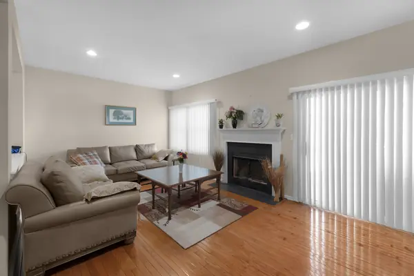 Living room with wood-burning fireplace