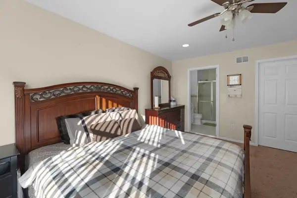 Bedroom with vaulted ceiling
